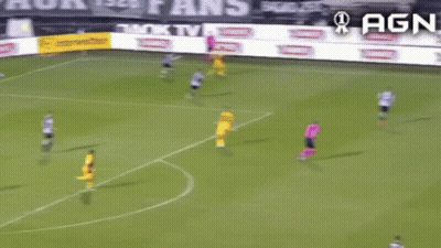 A Soccer Game Is Being Played On A Field With Advertisements For Agn In The Background GIF