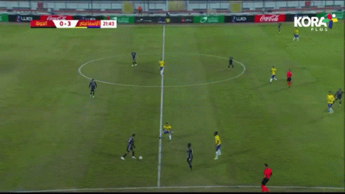 A Soccer Game Is Being Played On A Field With Coca-Cola Advertisements On The Sidelines GIF