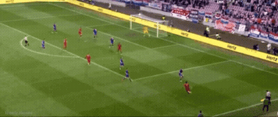 A Soccer Game Is Being Played On A Field With Hertz Advertisements On The Sidelines GIF