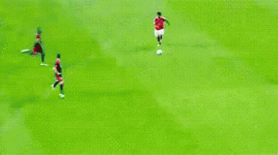 A Soccer Game Is Being Played On A Field With Players In Red And Black Uniforms GIF