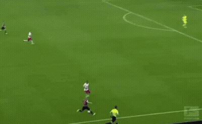 A Soccer Game Is Being Played On A Field With Red Bull Advertisements On The Sidelines GIF