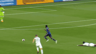 A Soccer Game Is Underway With A Heineken Ad In The Background GIF