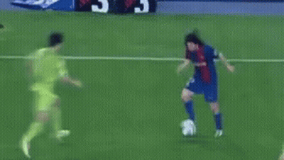 A Soccer Goalie Catches A Soccer Ball That Is Going Into The Net GIF
