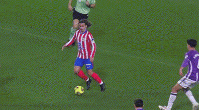 A Soccer Goalie In A Purple Jersey Is Diving To Block A Shot GIF