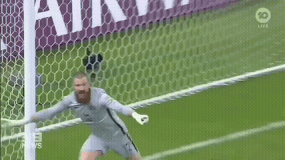 A Soccer Goalie Is Celebrating A Goal With His Arms Outstretched During A Game . GIF