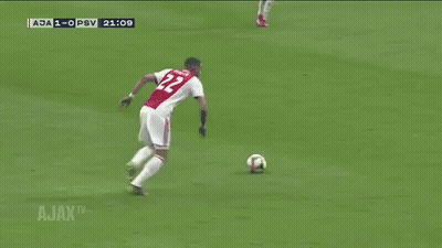 A Soccer Goalie Is Diving To Catch A Ball During A Match Between Ajax And Psv GIF