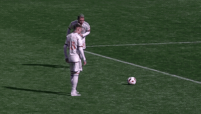 A Soccer Goalie Is Diving To Catch A Ball In Front Of A Target Sign GIF