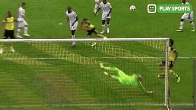 A Soccer Goalie Is Diving To Catch A Soccer Ball During A Game Sponsored By Play Sports . GIF