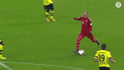 A Soccer Goalie Jumps In The Air To Catch A Soccer Ball With The Number 21 On It GIF