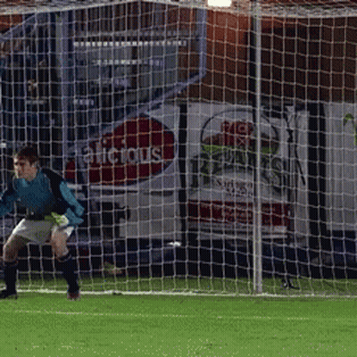 A Soccer Goalie Stands In Front Of A Net That Says Alicious On It GIF