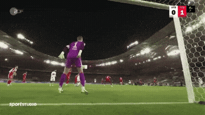 A Soccer Goalie With The Number 1 On His Jersey Jumps To Catch A Ball GIF