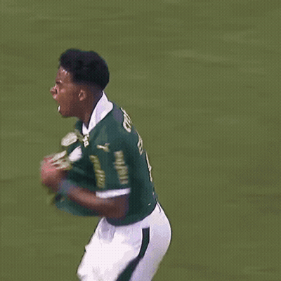 A Soccer Player Celebrates A Goal In Front Of A Banner That Says Retano GIF