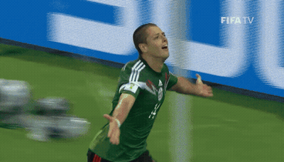 A Soccer Player Celebrates A Goal In Front Of A Fifa Tv Sign GIF