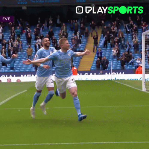 A Soccer Player Celebrates A Goal In Front Of A Playsports Banner GIF