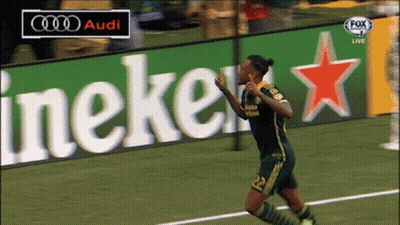 A Soccer Player Celebrates A Goal In Front Of An Audi And Heineken Sign GIF