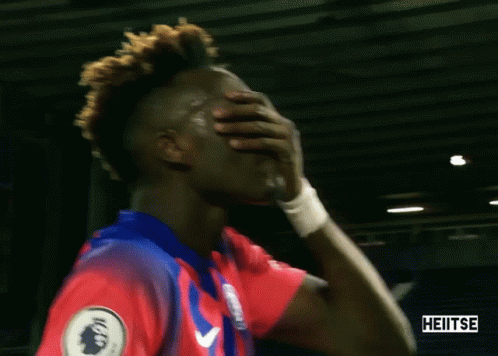 A Soccer Player Covering His Mouth With His Hand And The Word Heitse Is On The Bottom Right GIF