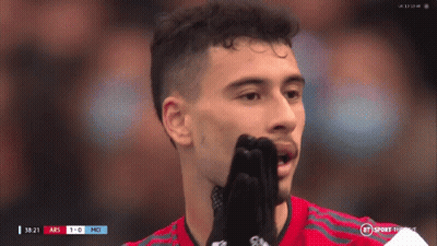 A Soccer Player Covering His Mouth With His Hands While Watching A Game GIF