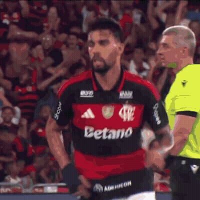 A Soccer Player Giving A Thumbs Up In Front Of A Scoreboard That Has The Number 2 On It GIF