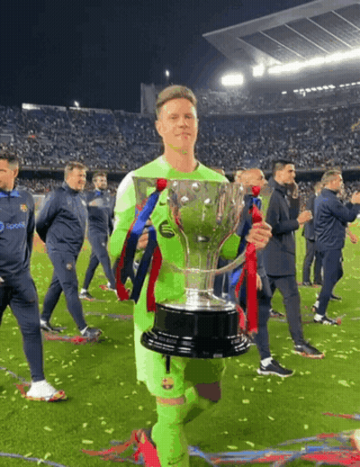 A Soccer Player Holding A Trophy With A Pepsi Logo On His Jersey GIF