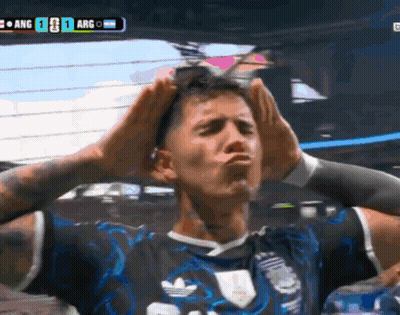 A Soccer Player Holds His Hands To His Head In Front Of A Scoreboard That Says Arg On It GIF