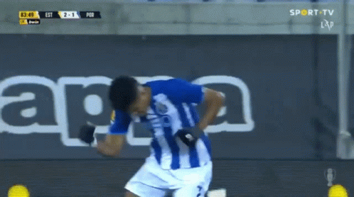 A Soccer Player In A Blue And White Striped Shirt Is Celebrating A Goal GIF