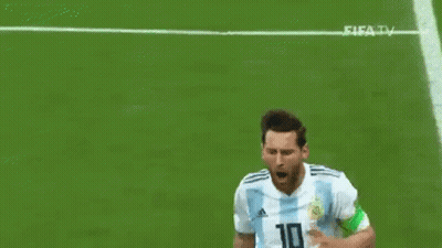 A Soccer Player In A Blue And White Striped Shirt Is Kneeling On The Field With His Arms Outstretched . GIF