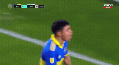 A Soccer Player In A Blue And Yellow Jersey Stands In Front Of A Goal During A Game GIF