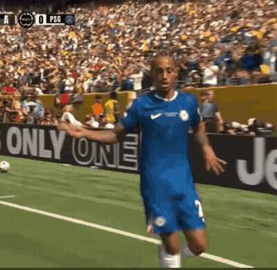 A Soccer Player In A Blue Jersey Stands On A Field In Front Of A Sign That Says " Only One " GIF