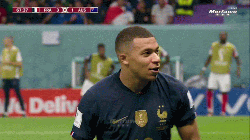 A Soccer Player In A Blue Jersey With A French Rooster On It GIF