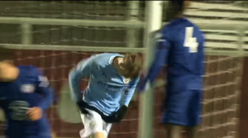 A Soccer Player In A Blue Jersey With The Number 4 On His Back GIF