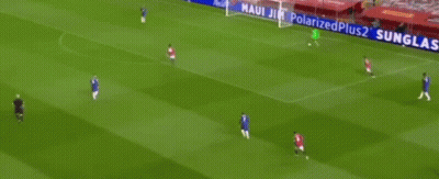 A Soccer Player In A Green Jersey Is Standing In Front Of A Net . GIF