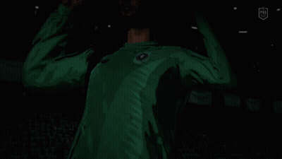 A Soccer Player In A Green Jersey With A Blue Circle On The Front GIF