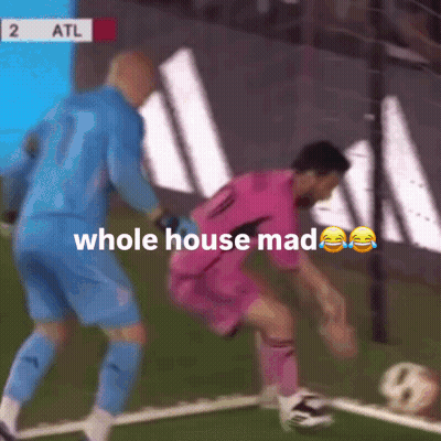 A Soccer Player In A Pink Shirt Is Being Tackled By A Goalie GIF