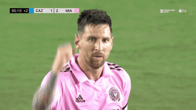 A Soccer Player In A Pink Shirt Looks At The Scoreboard Which Says Caz 1 2 Mia GIF