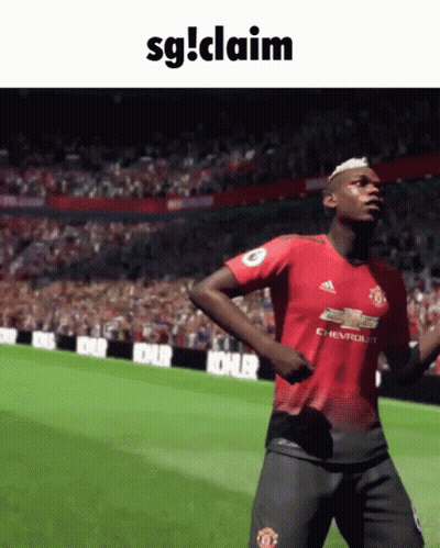 A Soccer Player In A Red Adidas Jersey Is Dancing On A Field GIF
