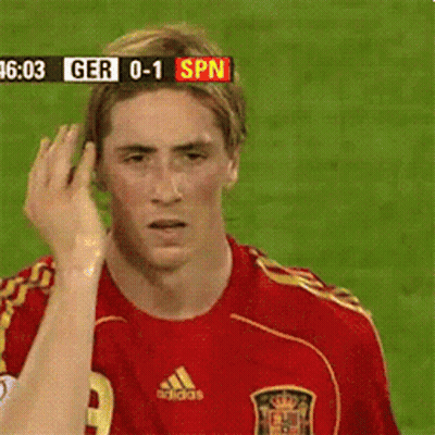 A Soccer Player In A Red Adidas Jersey Looks At The Camera GIF