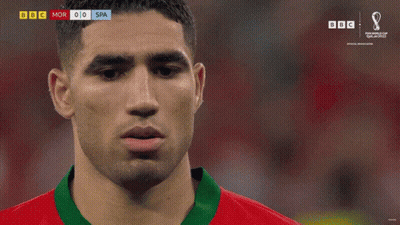 A Soccer Player In A Red And Green Jersey With The Number 2 On The Front GIF