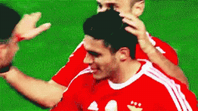 A Soccer Player In A Red And White Adidas Jersey GIF