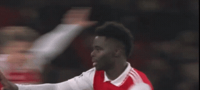 A Soccer Player In A Red And White Jersey Is Giving A Thumbs Up During A Soccer Game . GIF