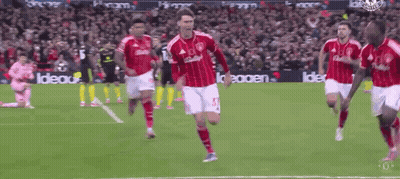 A Soccer Player In A Red And White Jersey With The Number 15 On It GIF