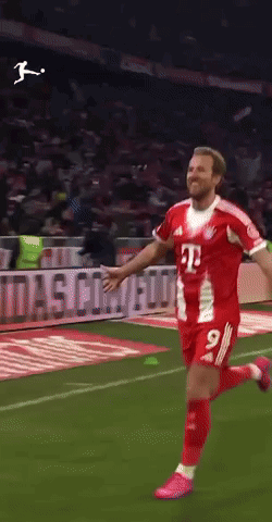 A Soccer Player In A Red And White Jersey With The Number 9 On It GIF