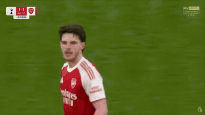 A Soccer Player In A Red And White Jersey With The Word Emirates On It GIF
