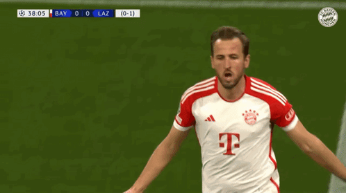A Soccer Player In A Red And White T-Mobile Jersey Is Running On The Field GIF