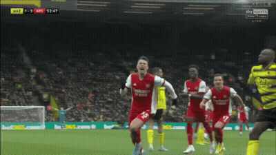 A Soccer Player In A Red Emirates Fly Better Jersey Celebrates GIF