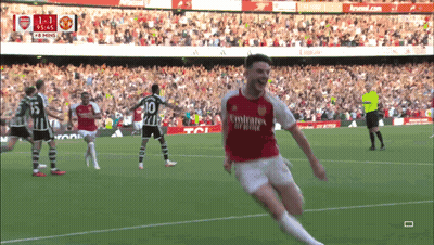 A Soccer Player In A Red Emirates Jersey Celebrates His Goal GIF