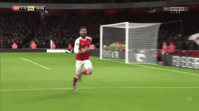 A Soccer Player In A Red Jersey Is Running Towards The Goal GIF