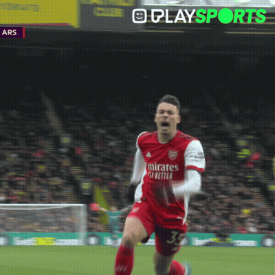 A Soccer Player In A Red Jersey With The Number 11 On His Shorts Is Running On The Field GIF