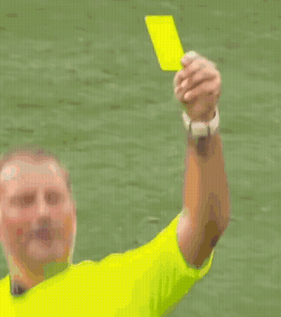 A Soccer Player In A Red Shirt Is Getting A Yellow Card GIF