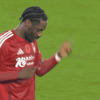 A Soccer Player In A Red Shirt With The Number 10 On It Shakes Hands With Another Player GIF