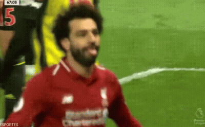 A Soccer Player In A Red Shirt With The Number 15 On His Jersey GIF